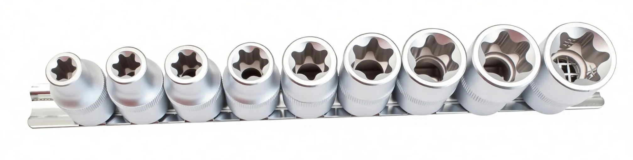 Top/front view of nine female Torx sockets in a row showing internal star profiles