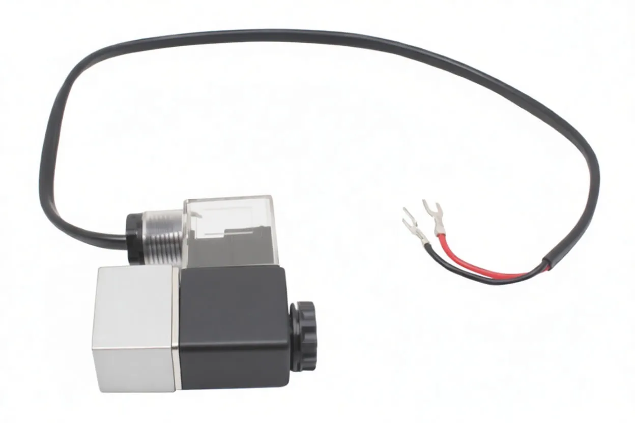Angled shot of solenoid valve with clear coil cover, labeled black housing, aluminum valve body and long black cable with spade connectors.