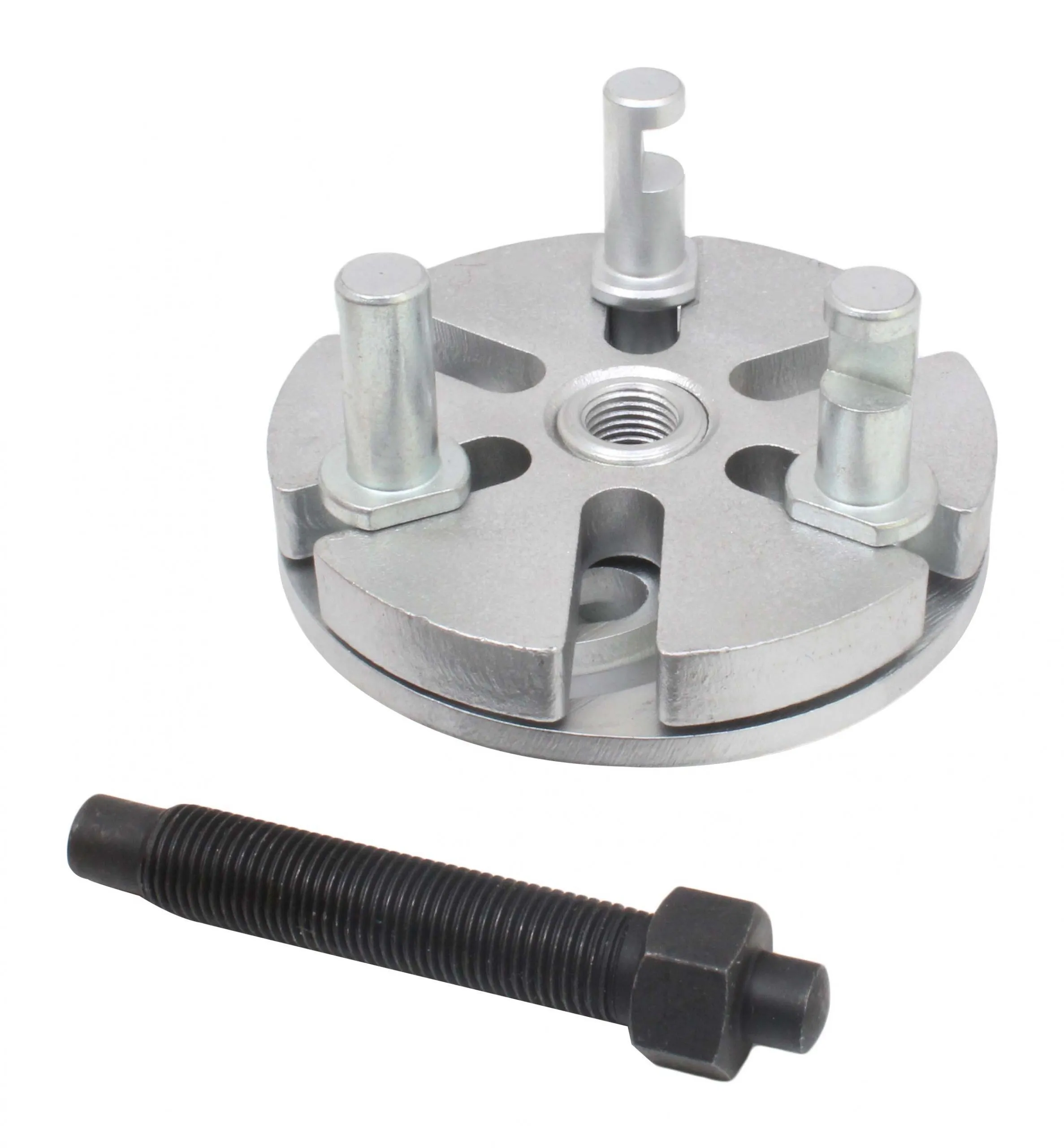 Top view of silver puller plate with three pins (one notched) and black threaded forcing bolt in front