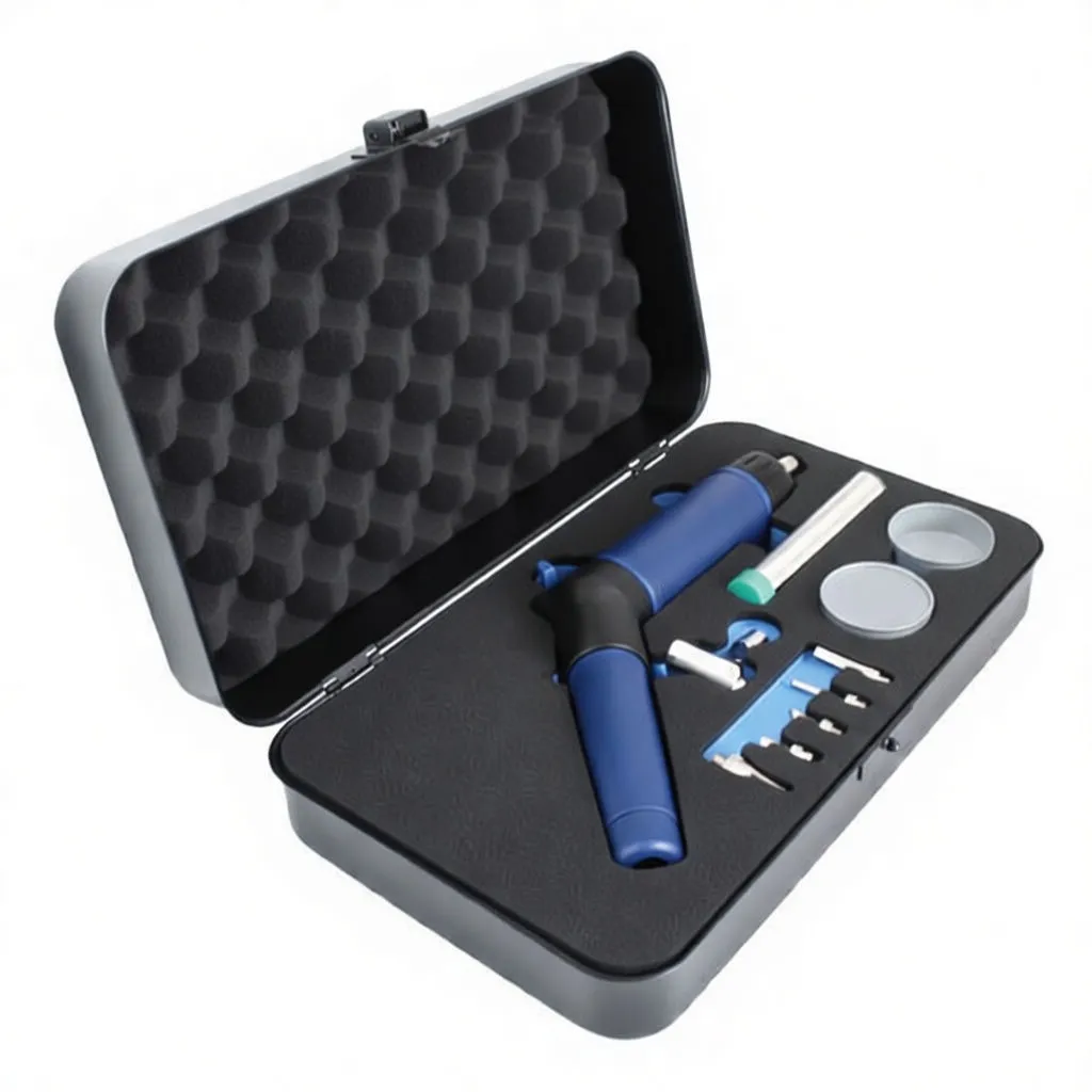 Angled perspective of an open metal case containing an ASTA gas soldering iron/torch with clear nozzle, adapter, sponge dish and four small tips in foam.