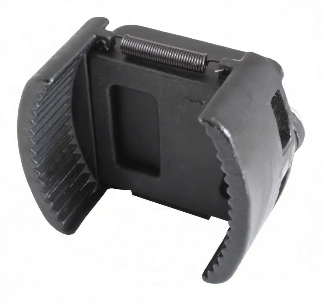 Side view of reversible oil filter cap wrench showing serrated jaws, spring, embossed 'R' and partial white markings