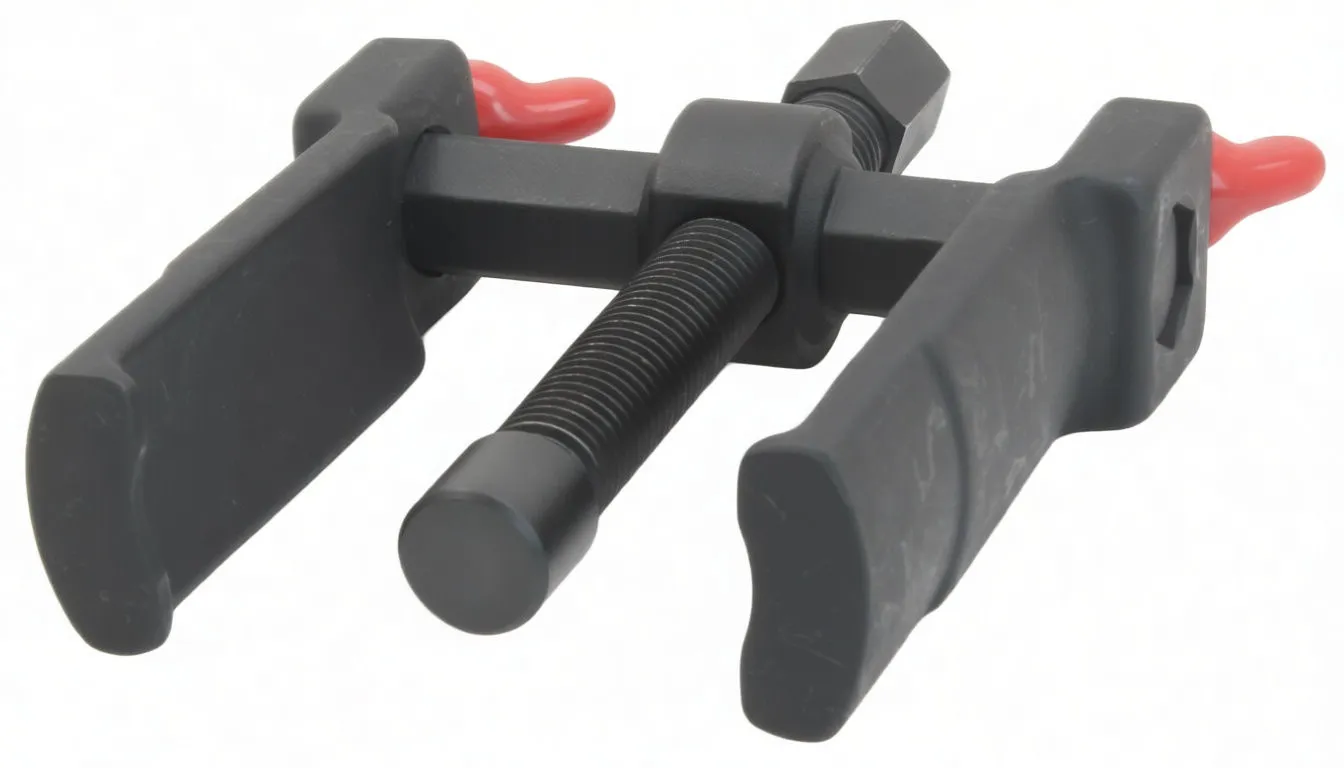 Angled side view of a black metal wiper arm puller with threaded rod, hex head, broad jaws and red protective claw tips.