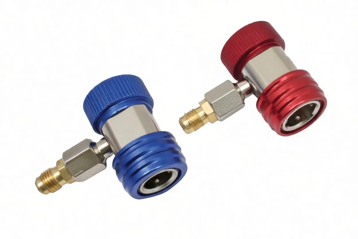 Red and blue quick-coupler refrigerant fittings close-up, showing metal bodies and brass connectors