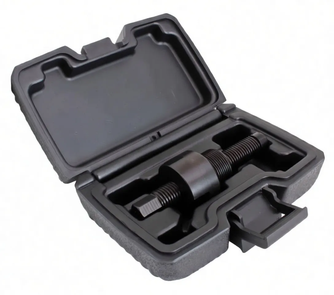 Angled perspective of an open tool case with a black threaded alternator cover puller labeled ASTA A-MK817 and three threaded extractor rods in molded compartments.