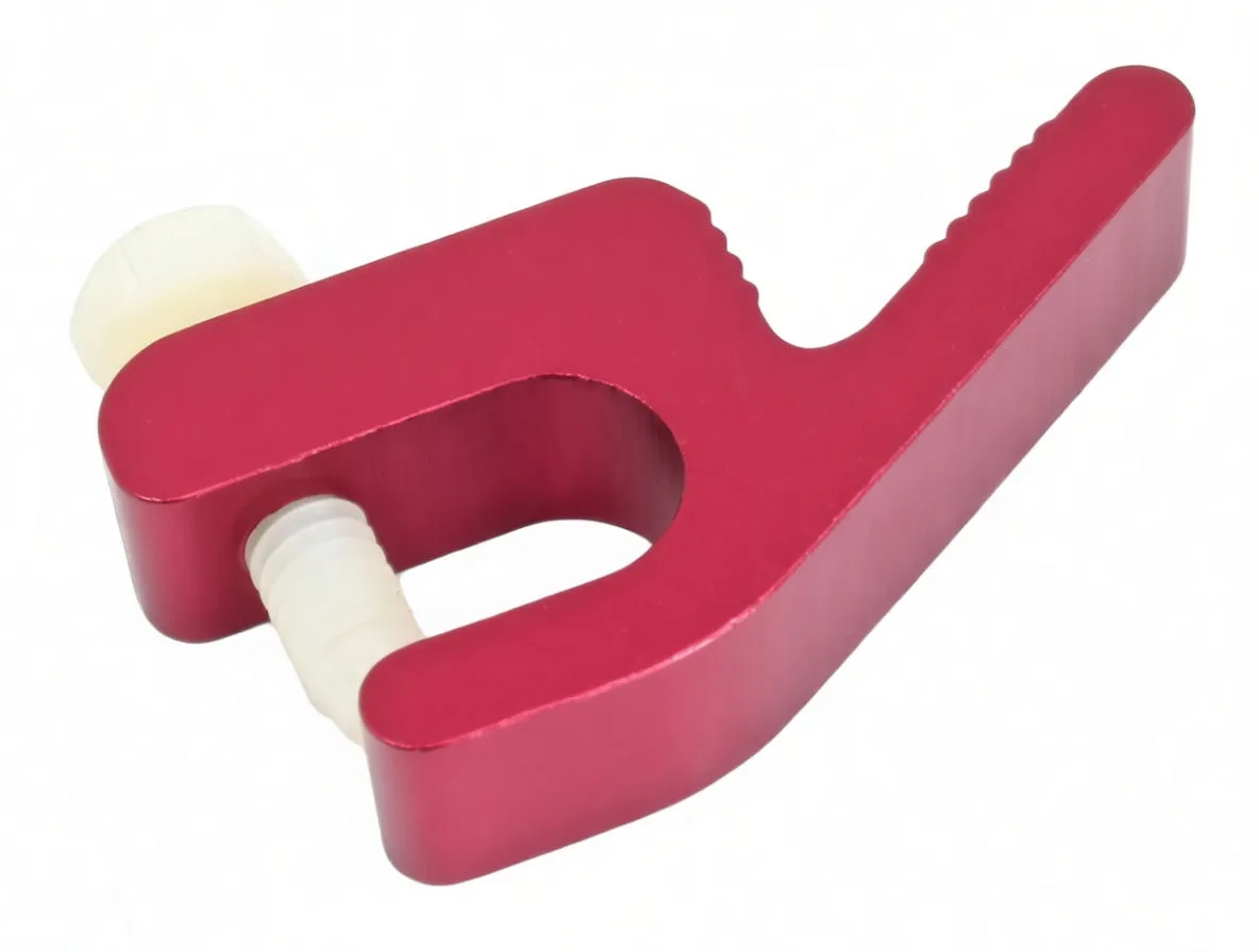 Angled top-front shot of red ASTA A-MK355 tire bead tool showing logo, jaw opening, textured handle and white threaded peg