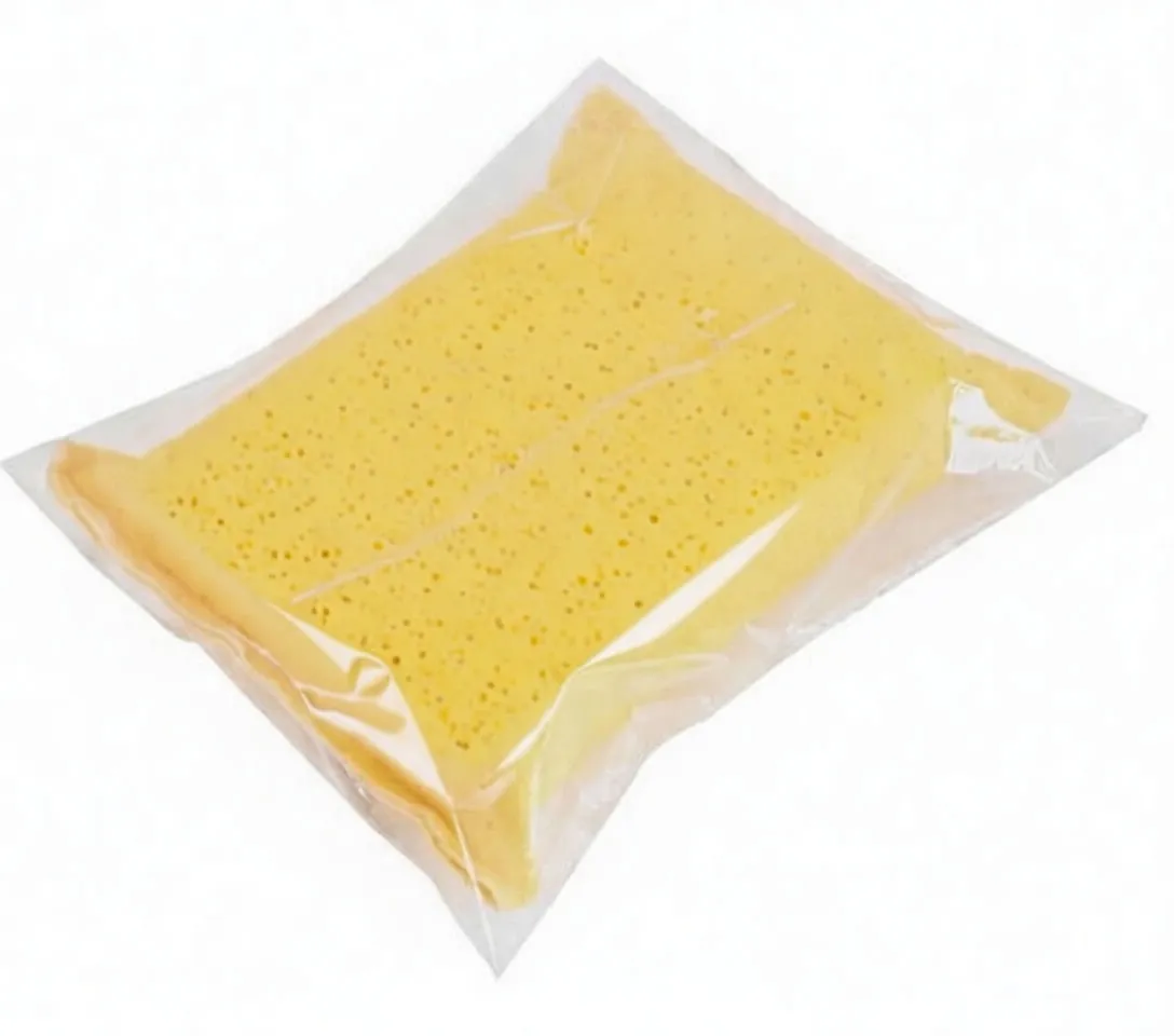 Yellow perforated sponge in clear retail plastic packaging with black label, blue logo banner and barcode