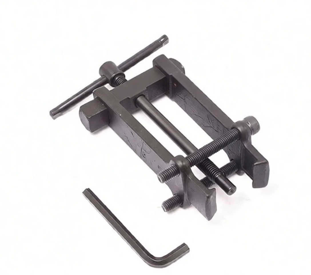 Angled top view of ASTA branded armature bearing puller with central screw, T-bar handle and separate L-wrench