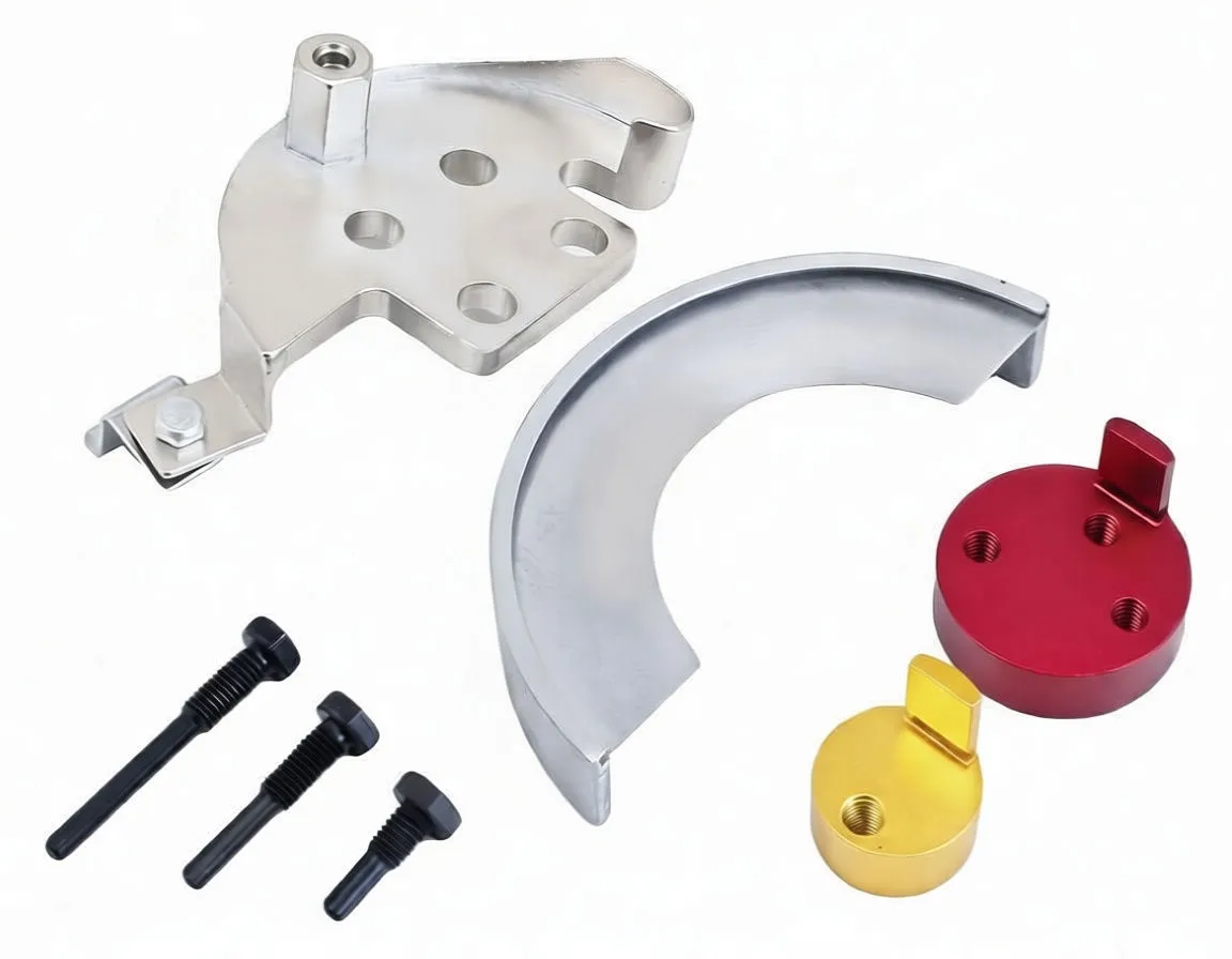 Tool components laid out: semicircular metal brace, mounting plate with peg, red and gold adapters and three black bolts