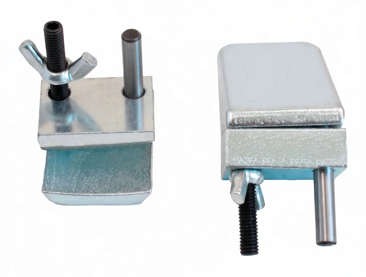 Close-up of two silver zinc-plated auxiliary stretch-belt removal tools, showing pins, wing nut and faint stamped model marking.