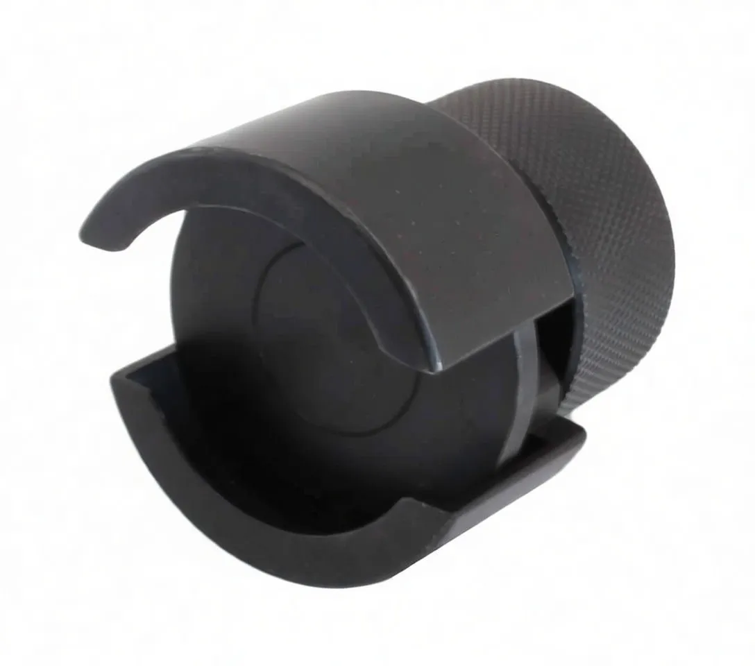 Front view of black balance shaft puller showing U-shaped cup cutouts, smooth inner face and SaTra S-X4SP marking with knurled body behind