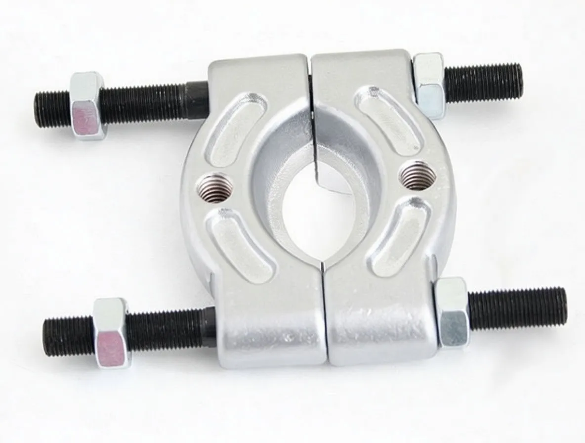 Front view of split bearing separator with central gap, threaded rods and hex nuts, 'satra S-DBR1' marking visible.