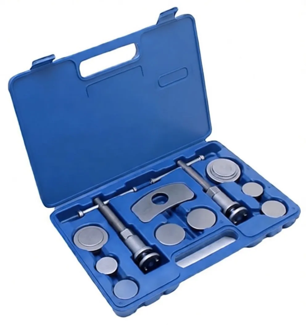 Side-angled shot of open blue carry case with two threaded retraction tools and assorted round adapter plates placed in custom molded pockets.
