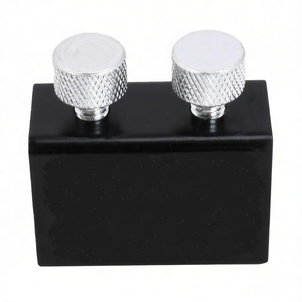 Front view of black clamp showing ASTA A-MK299 logo and two silver knurled screws on top