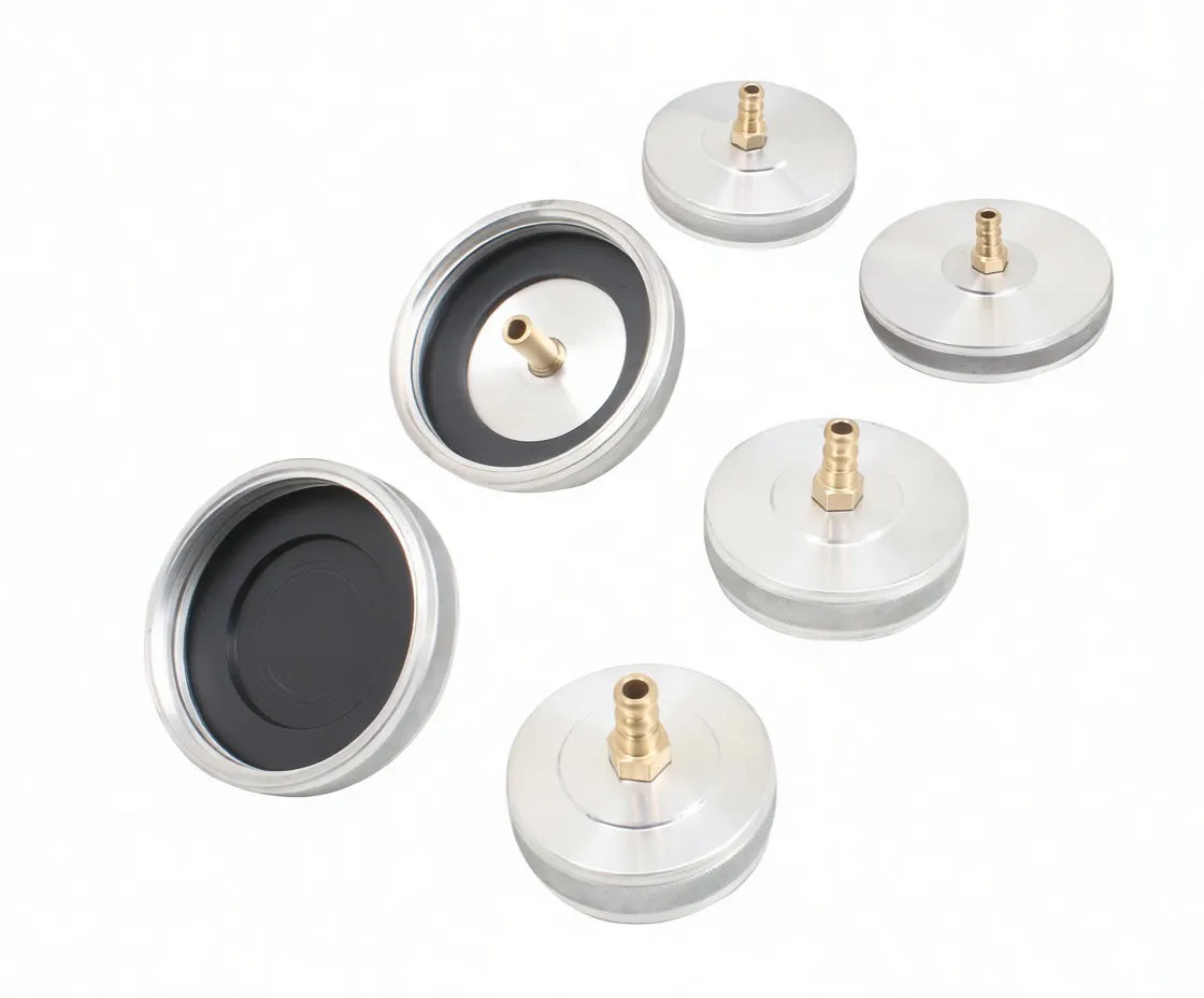 Adapters showing black rubber diaphragms inside and brass center tubes