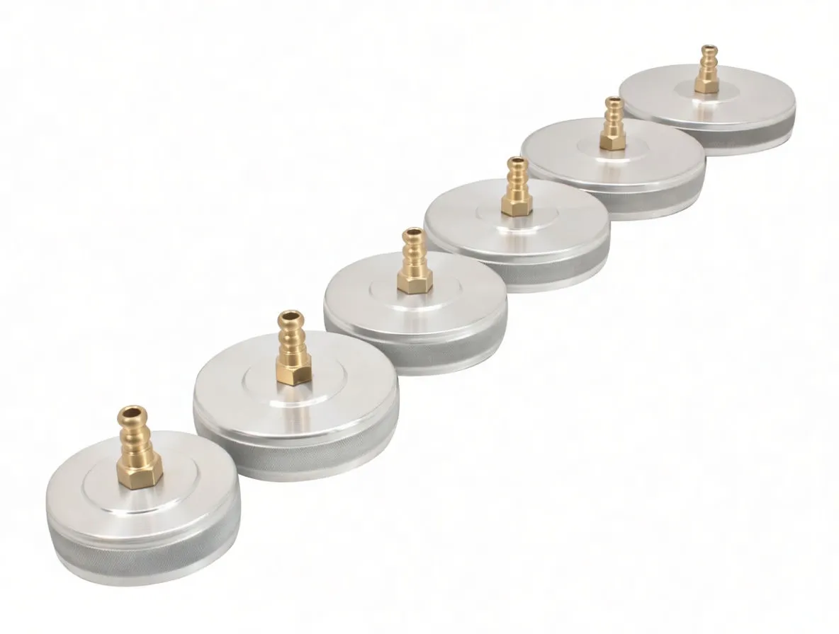 Angled view of six silver disc adapters with brass barbed fittings in a row