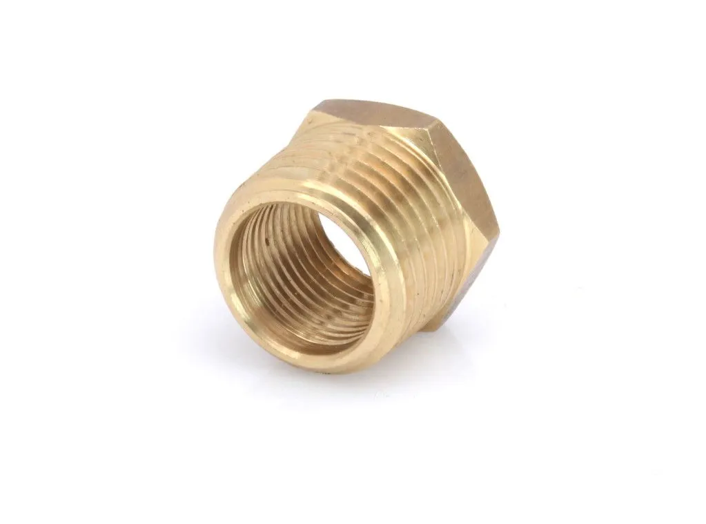 Angled shot of brass reducer showing inner threads and hex flats