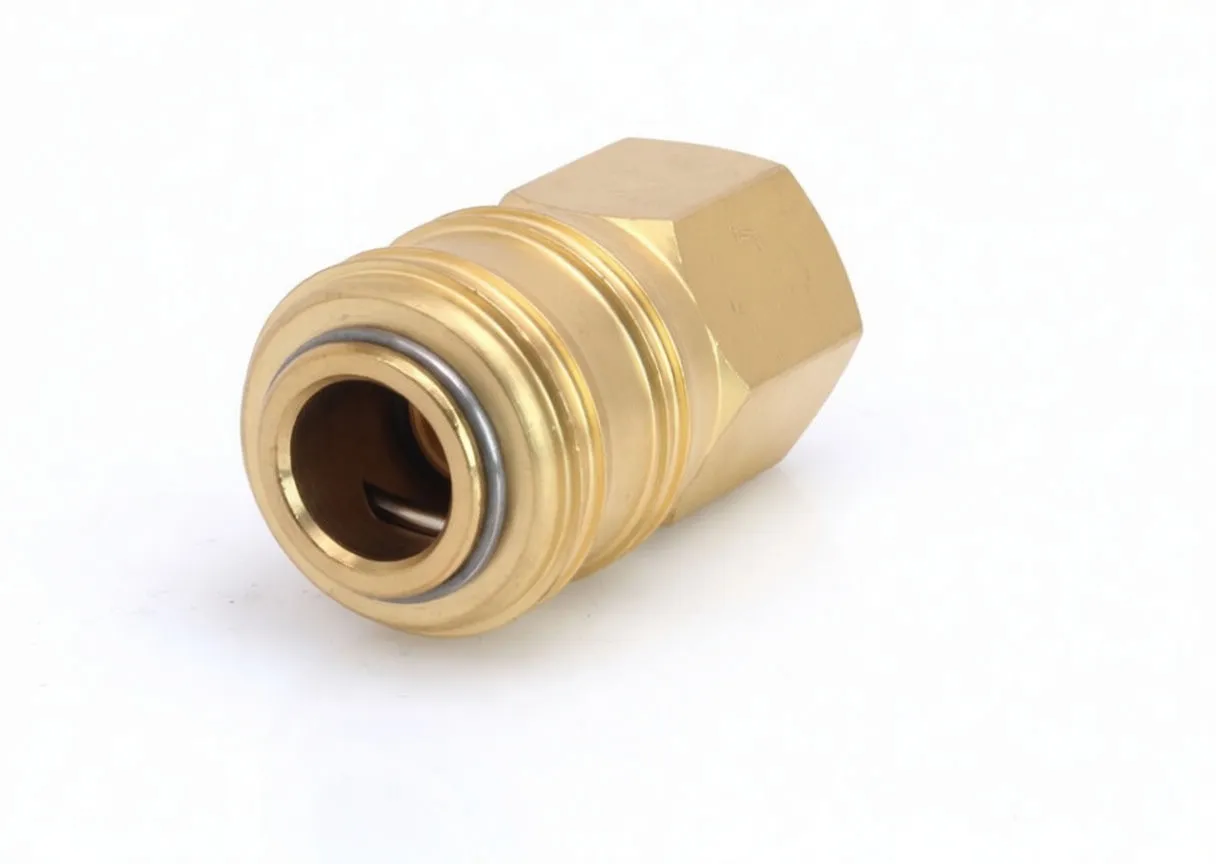 Front view of brass quick connector showing coupling bore with retaining ring, grooves on sleeve and hexagonal nut body.