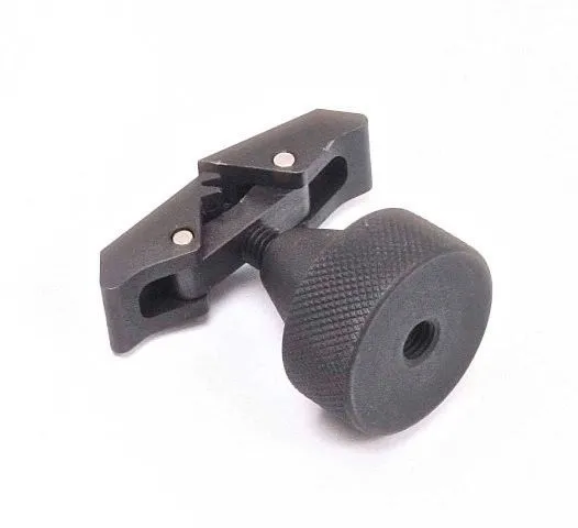Knurled round black adjustment knob attached to a slotted clamp body with serrated teeth and two small steel pins.