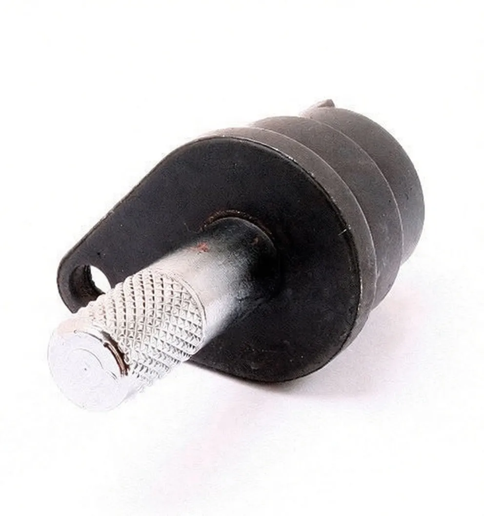 Angled view of camshaft alignment tool showing 'satra' and 'SPINL2' markings with knurled chrome pin.