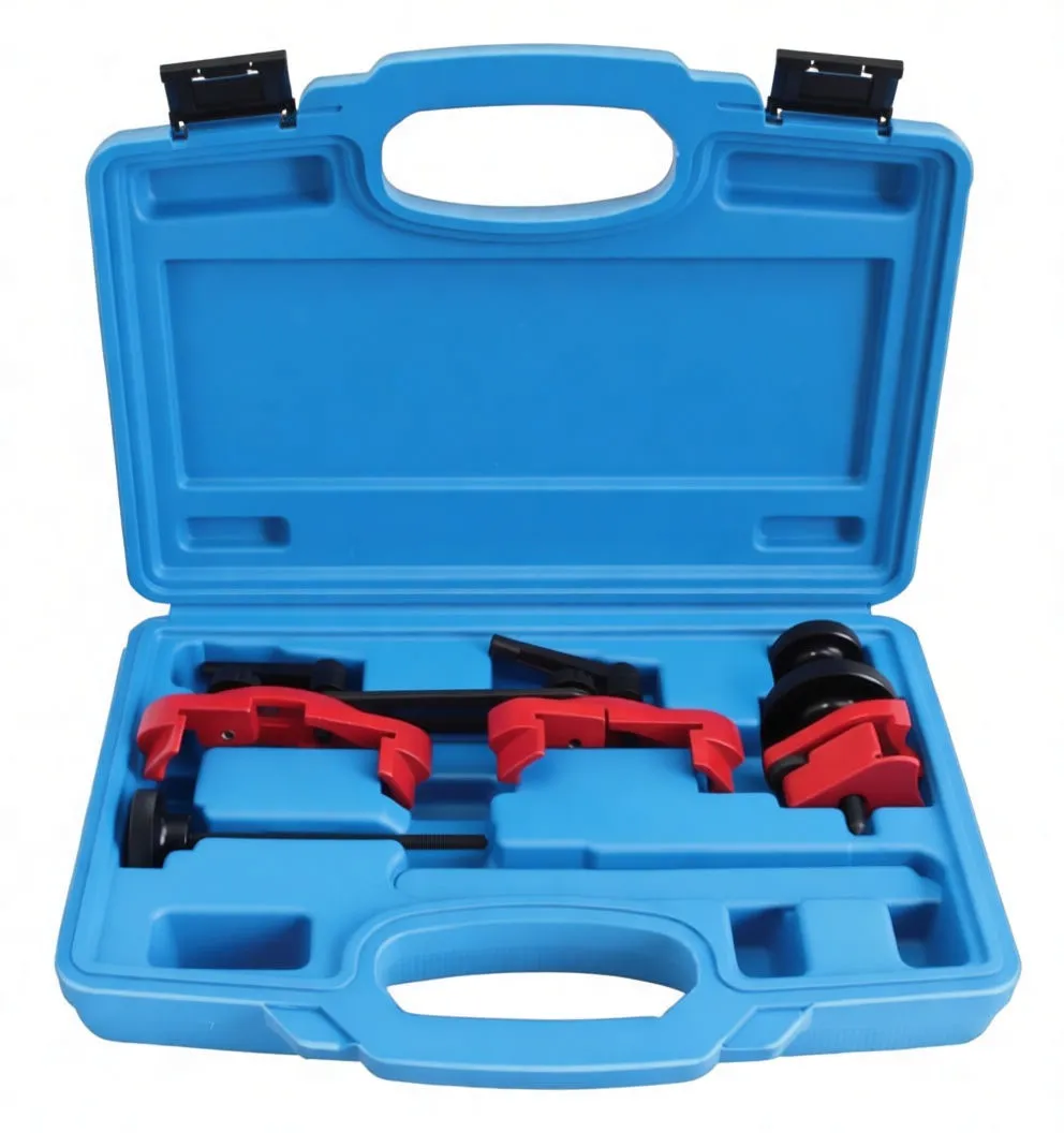 Tools removed from case: red locking jaws, slotted black spanner with white marking, threaded puller rod with knurled head, knurled discs and red adapter