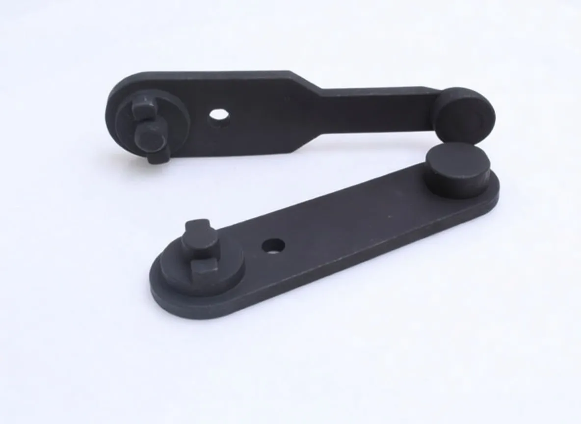 Two black ASTA A-2P camshaft locking plates on white background, showing circular pads and locator pins