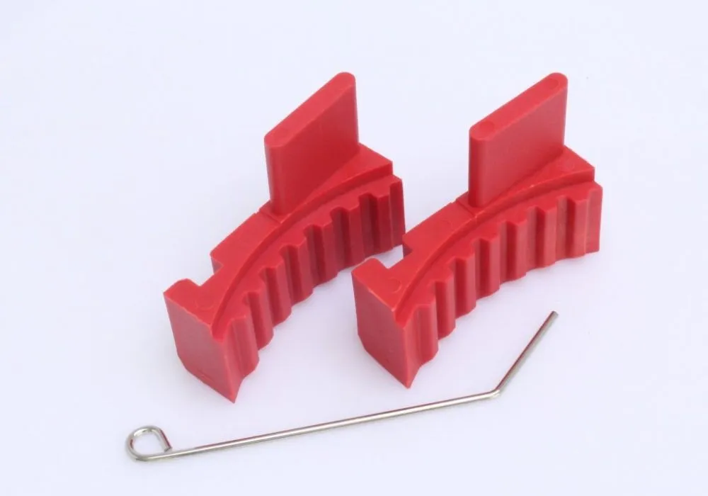 Angled view of two red timing tool blocks with metal alignment pin