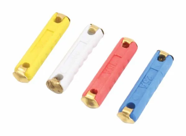 Macro shot of four fuses showing embossed amp markings (16A, 25A), brass end caps and end notches