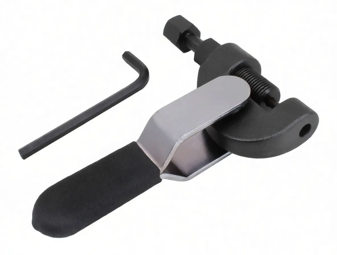 Close-up of chain breaker showing threaded drive screw, C-shaped jaws, ASTA stamped lever, foam grip and Allen key.