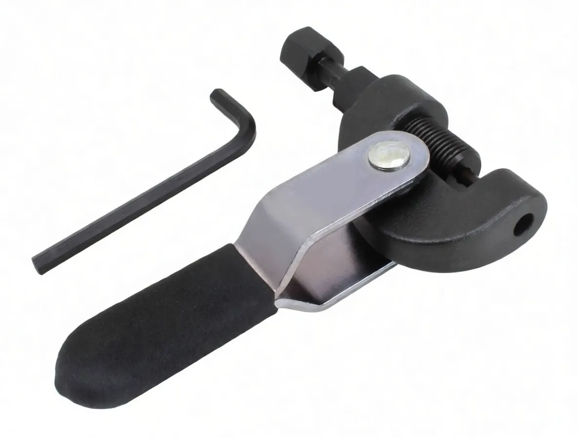 Top-down view of chain breaker showing pin driver tip, jaw hole for chain link, ASTA lever and separate Allen key.