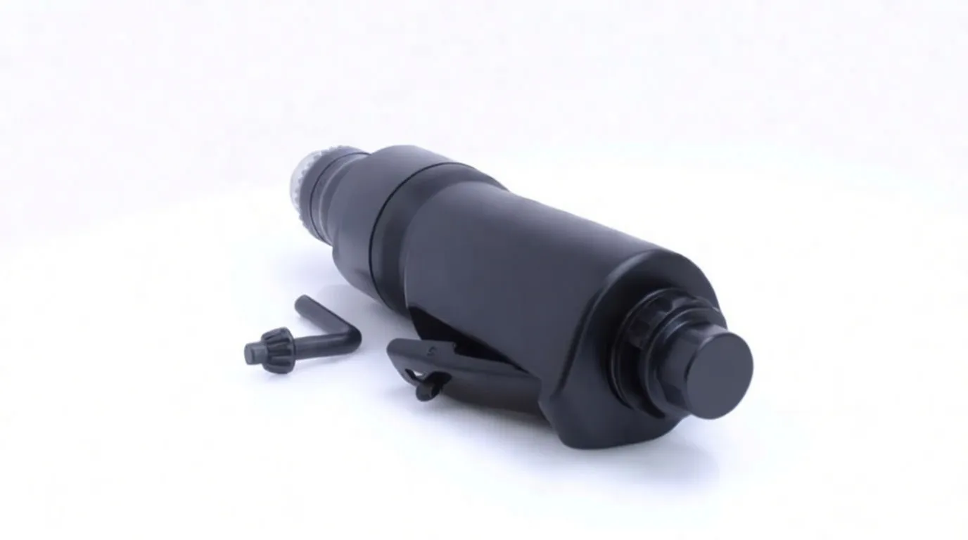 Rear-side view of ASTA die grinder on white background with chuck key and hex key beside it