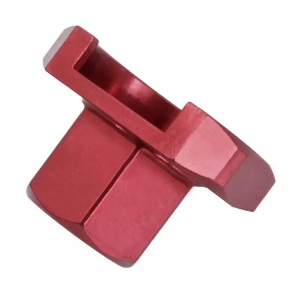 Side angled view of red compression valve tool showing hex flats and U-shaped slot