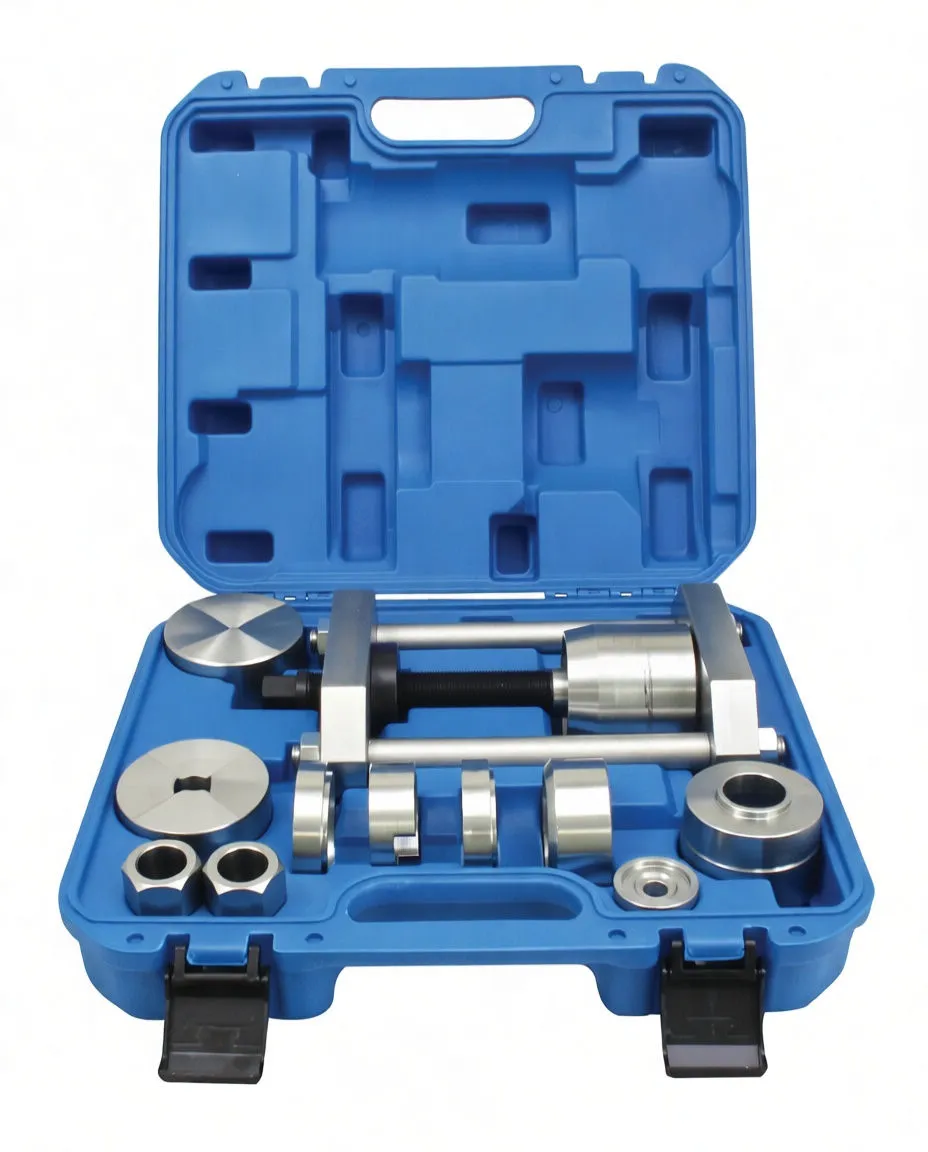 Pin press frame and a spread of machined aluminum adapter cups, sleeves and rings laid out separately