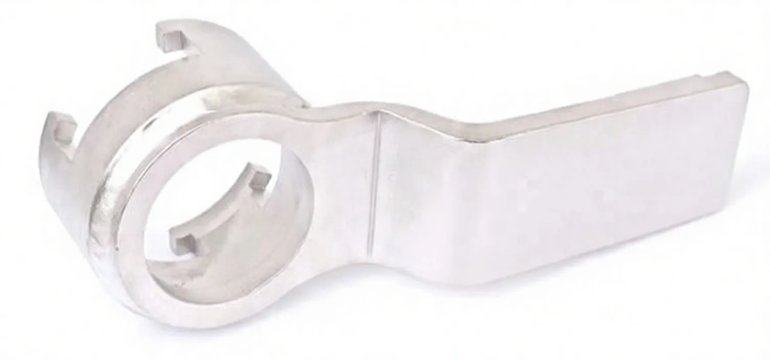 Side view of silver crank pulley lever with S-shaped arm, circular collar with three slots and faint stamped marking near square recess.