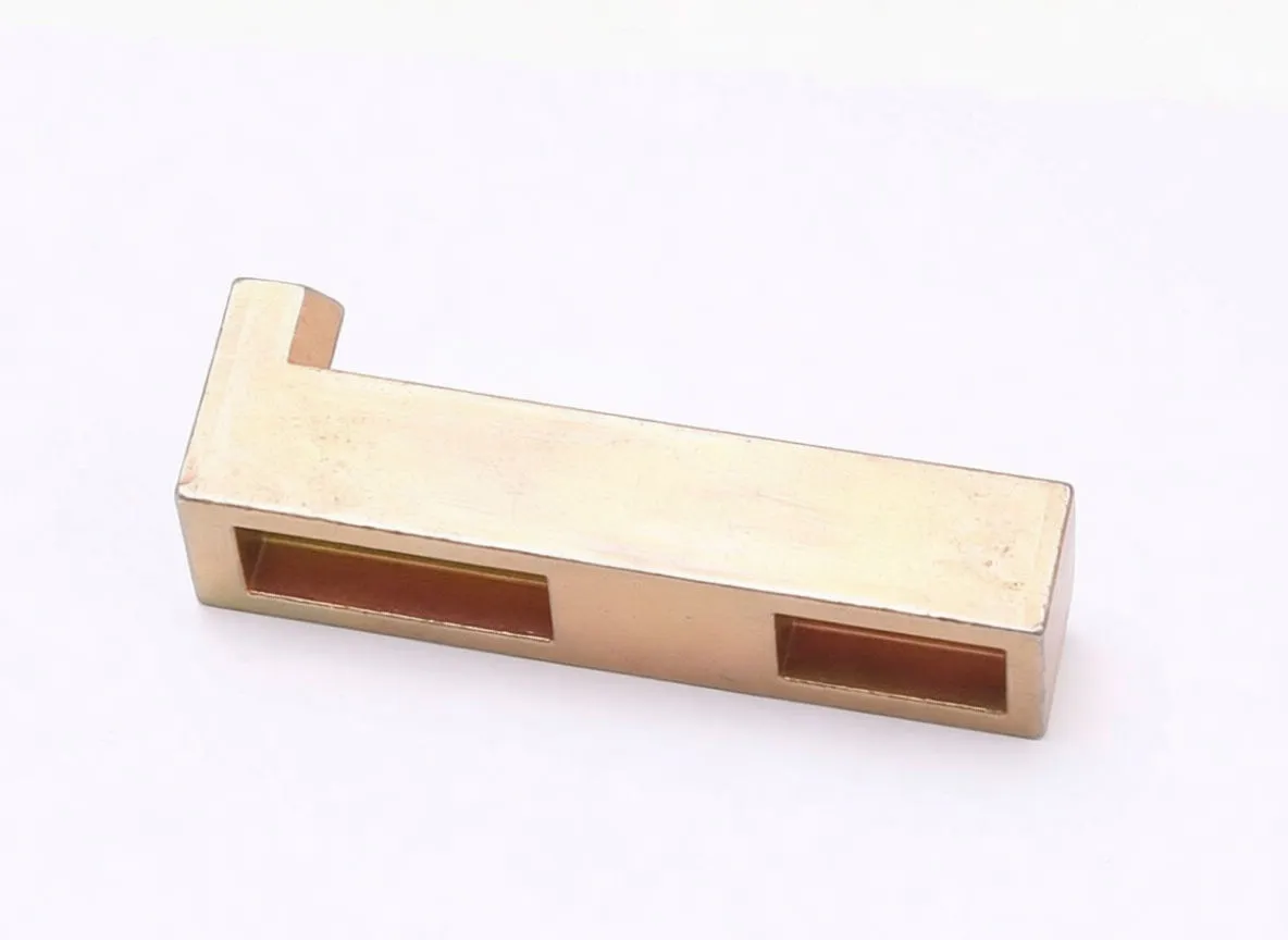 Brass rectangular timing bar marked 'saTra' with central pin and a stepped black adapter mounted on top