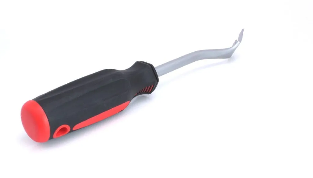 Curved metal shaft and angled prying tip of a black and red door upholstery removal tool.