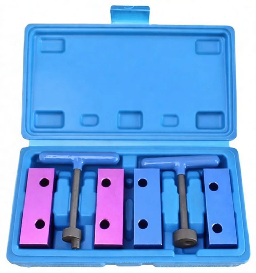 Top view: blue case with four anodised blocks (purple and blue), three black T-handle bolts and a yellow instruction label in the lid