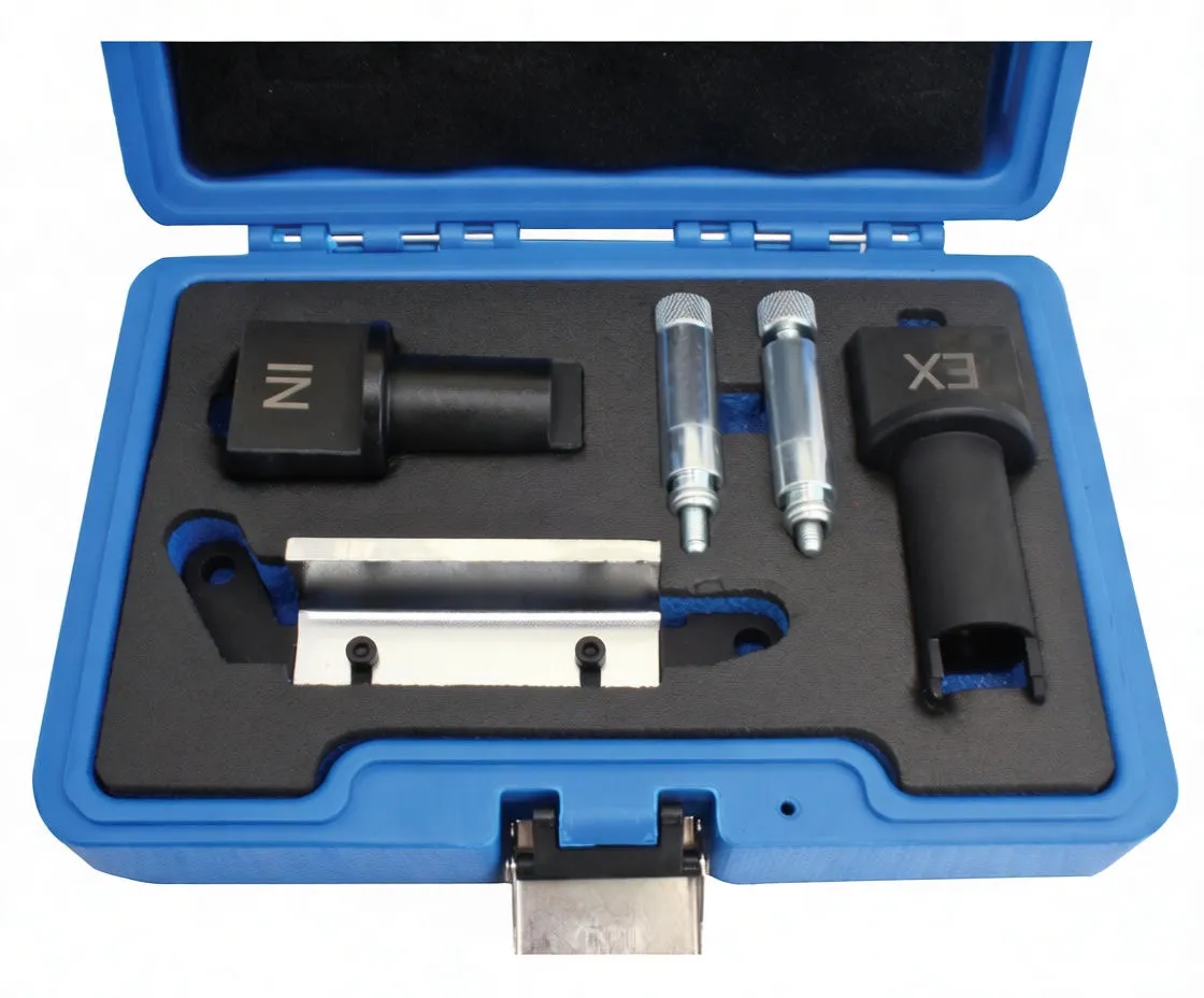 Top-down close-up of timing adaptor components in foam: IN and EX adapters, two knurled pins and metal bracket with faint stamp