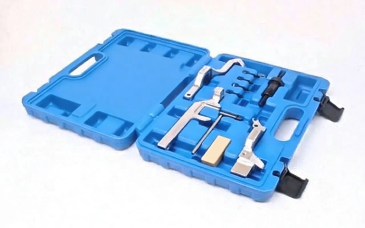 Angled view of blue tool case with timing locking brackets, threaded puller, T-pin and locating pins