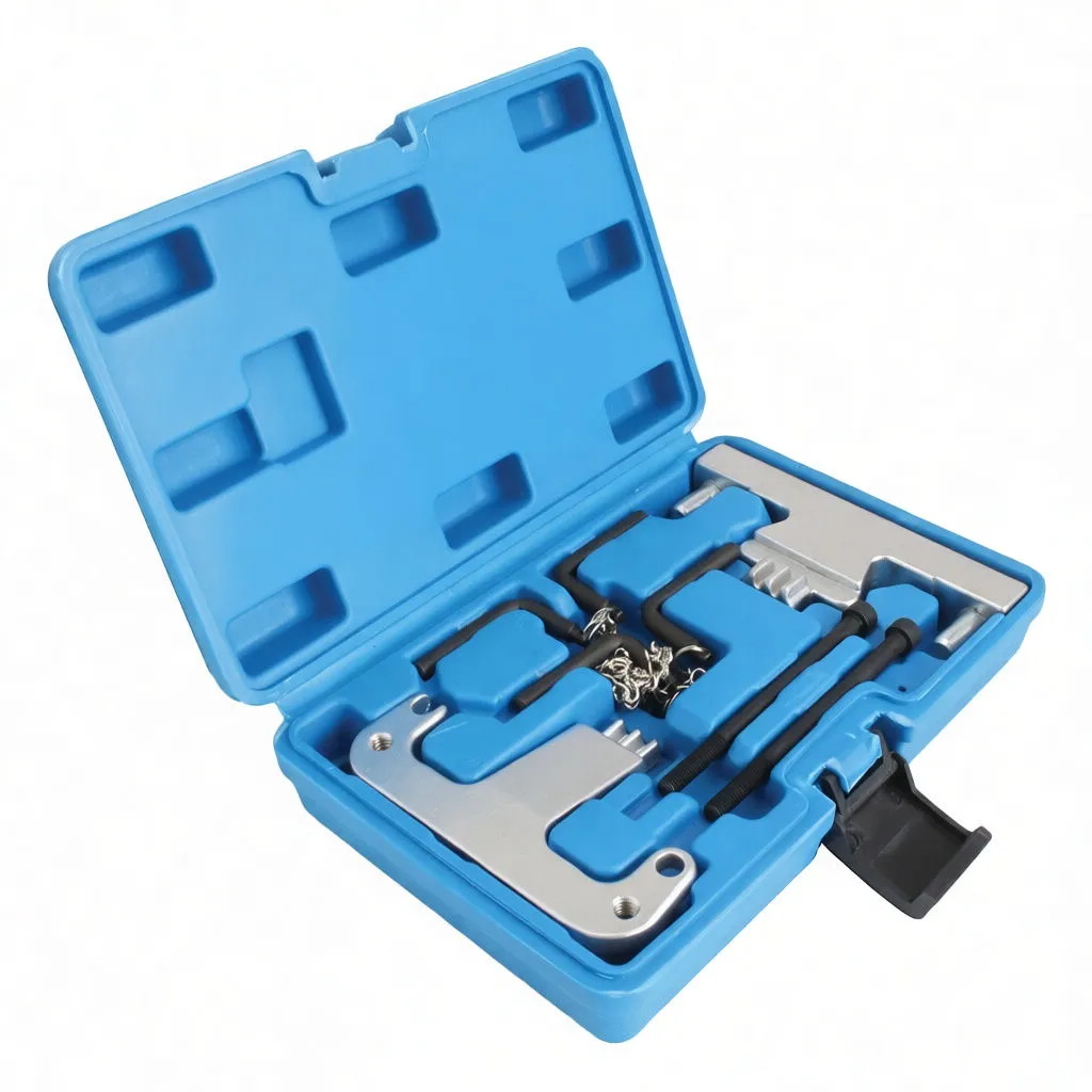 Angled shot of engine timing tool kit in blue case showing locking plates, threaded rods, pins, chain and instruction label