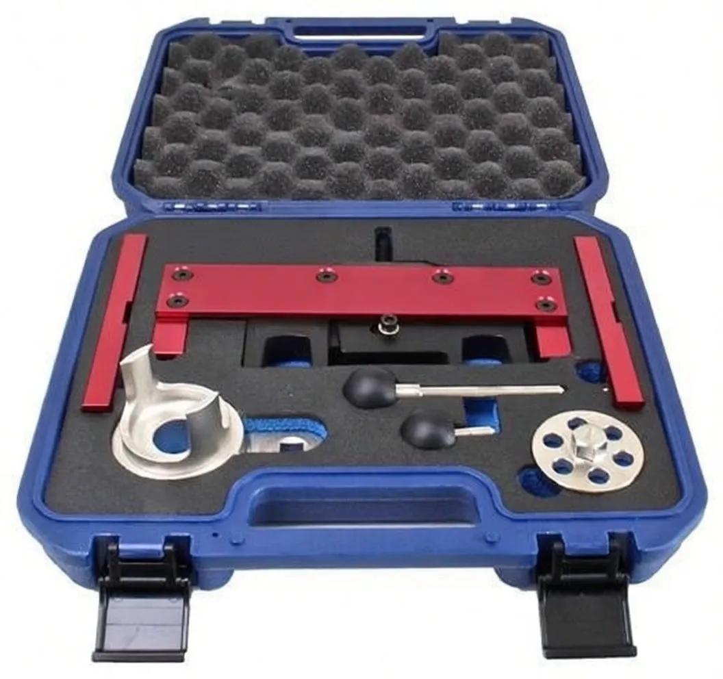 Top view of blue case with engine timing tools: red marked bars, silver alignment cup, round multi‑hole wheel, black rubber‑tipped pins and yellow instruction label.