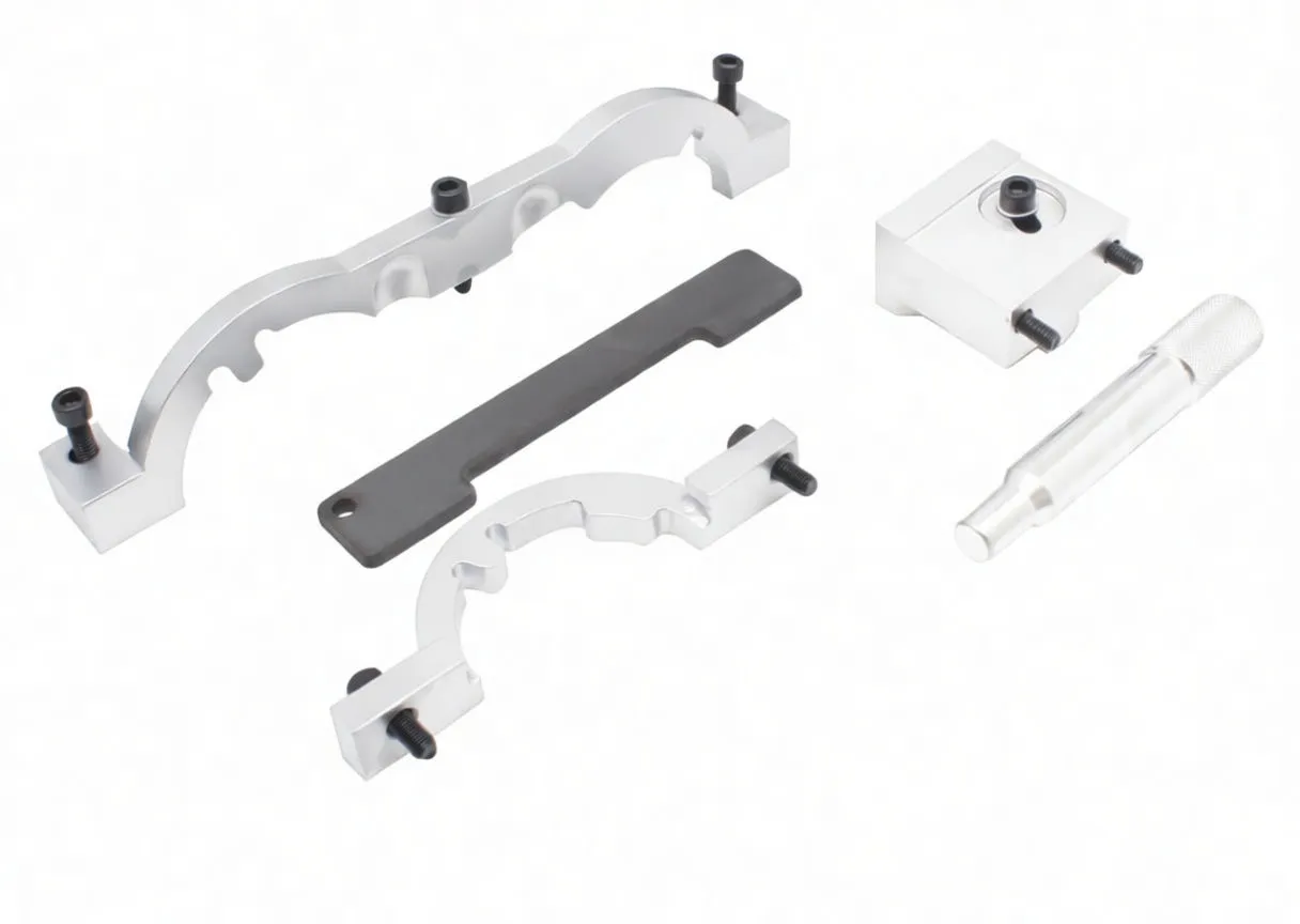 Flat lay of engine timing tool components: two silver arcuate brackets, black timing plate with gold text, square locating block, knurled pin/driver and two small locating pins.