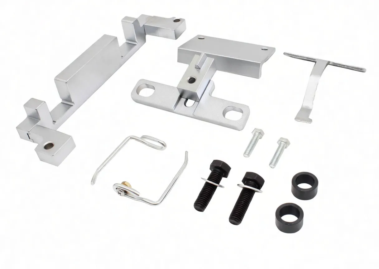 Timing tool components on white background: aluminium brackets, locating bracket, T-pin, wire clip, black bolts, silver bolts and rubber spacers.