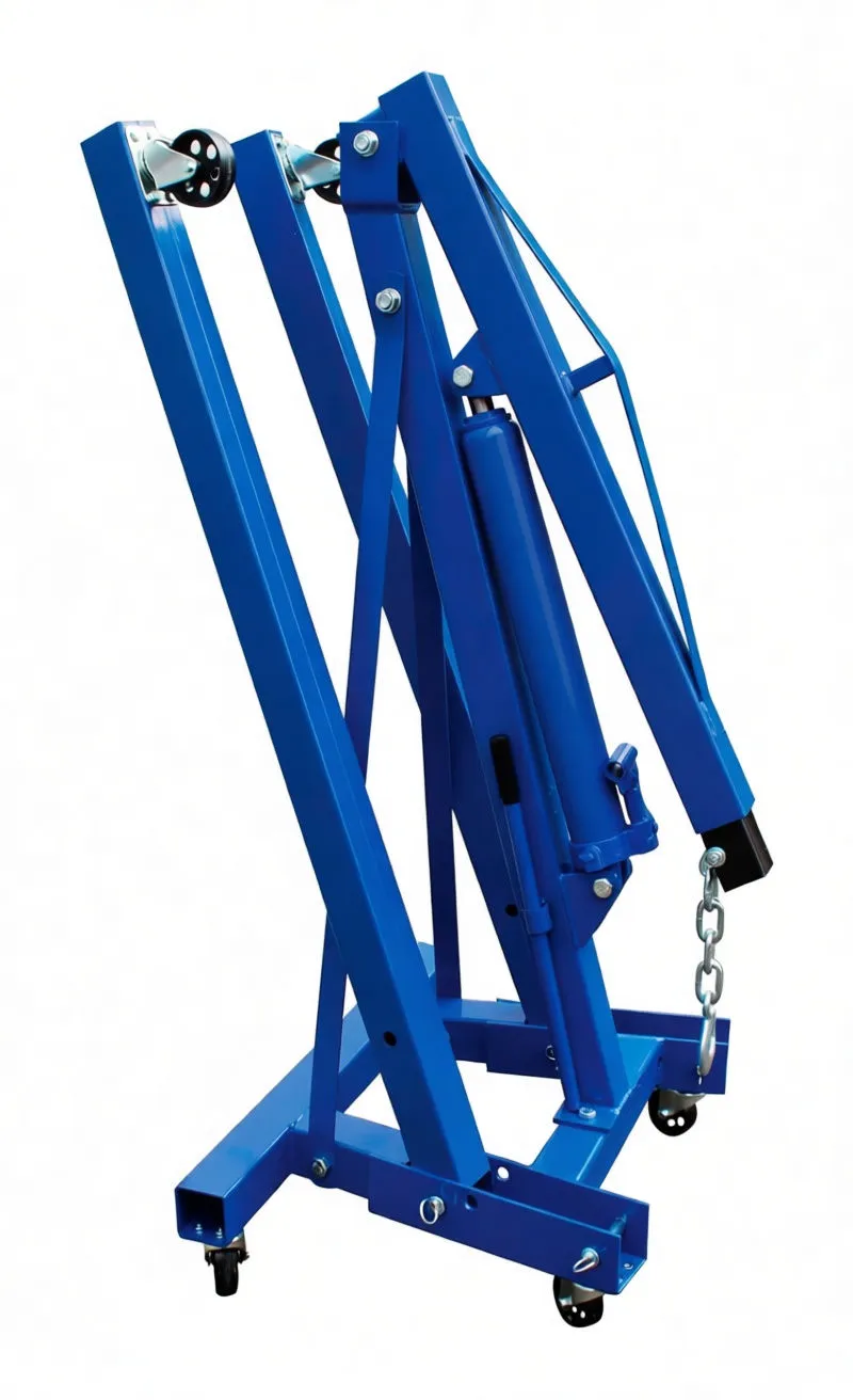 Crane folded for storage showing boom with tonnage markings, hinge pins, warning label and hook