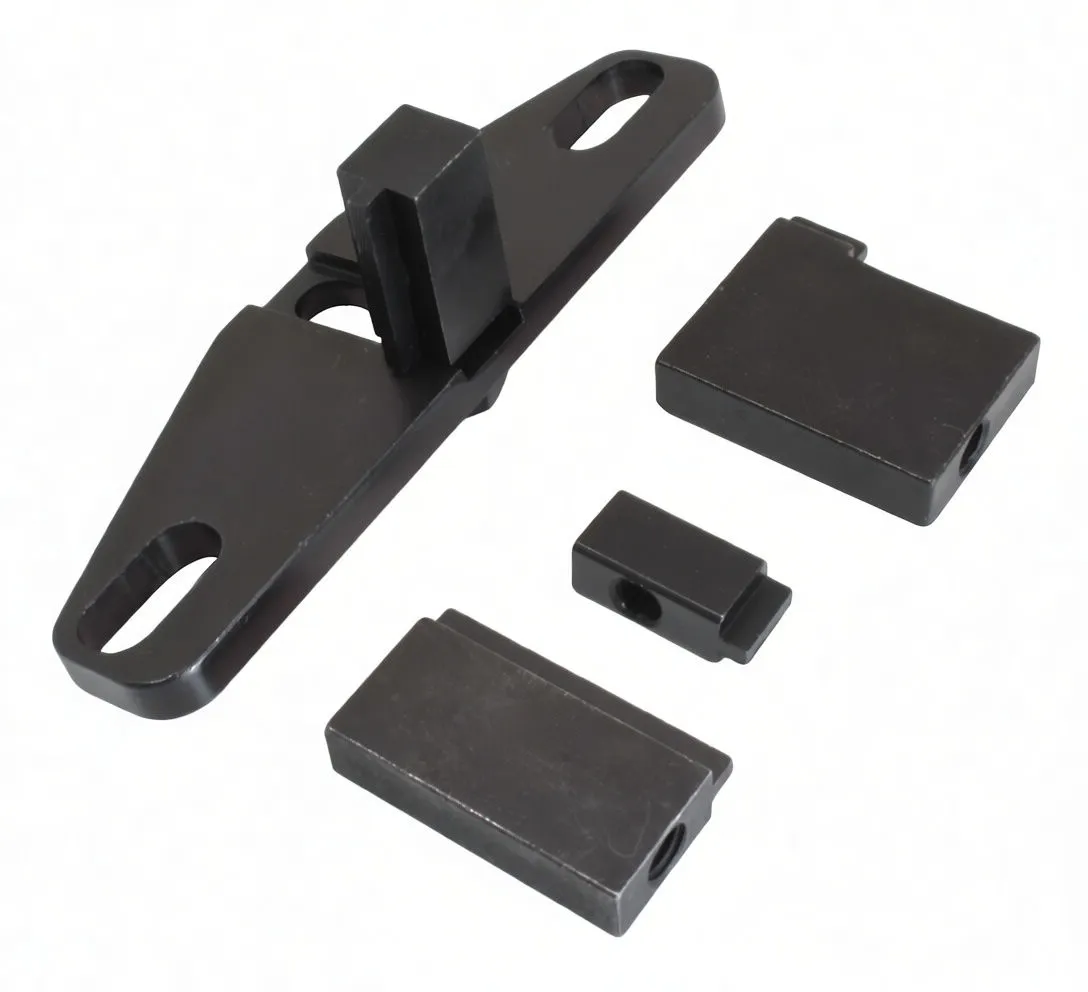 Angle view of flywheel locking tool showing upright locking tongue in plate and three SaTra-marked rectangular blocks