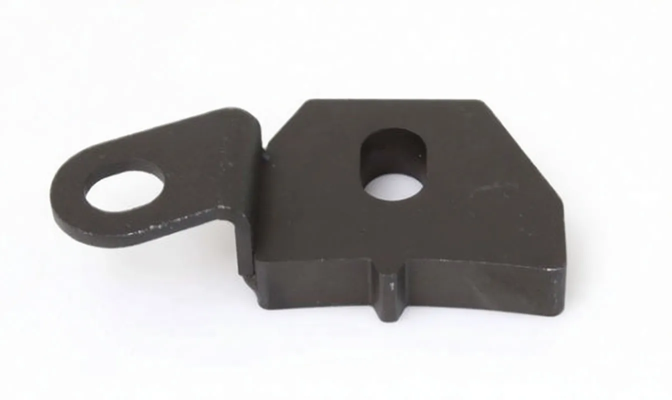 Black metal mounting bracket with round hole, oblong center hole and ASTA marking