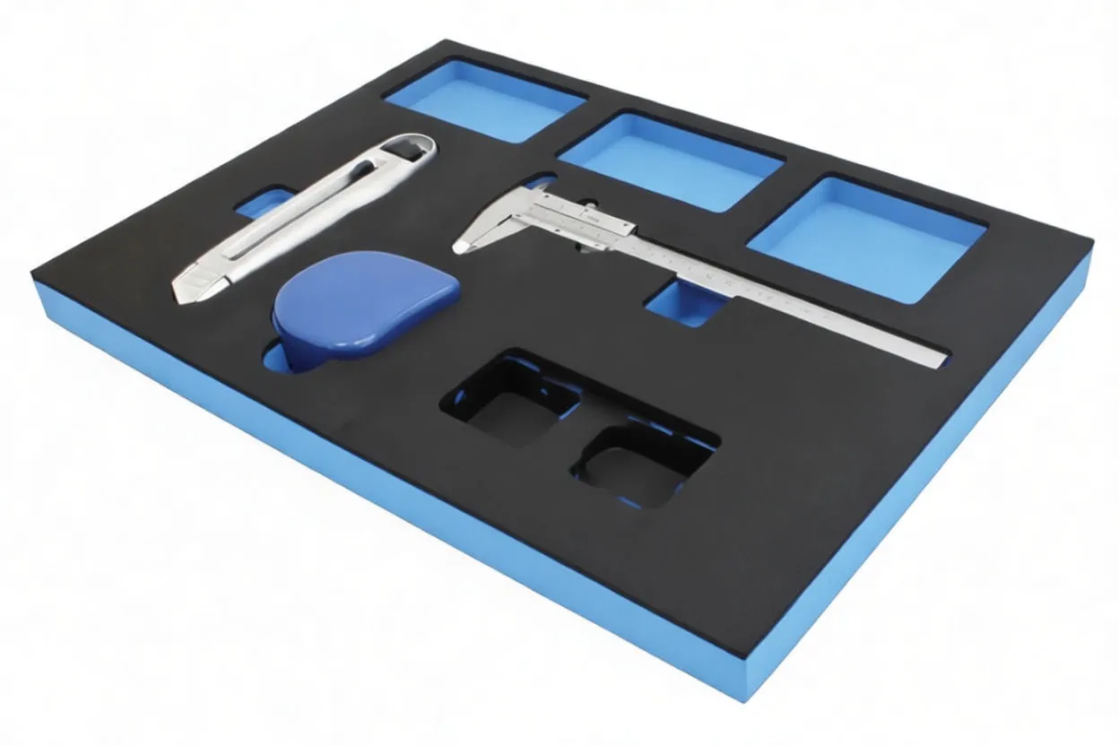 Angled perspective of foam tool module with caliper, utility knife, tape measure and Satra tin in black and blue foam insert