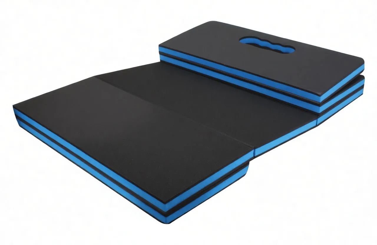 partially unfolded black folding mat with blue edges, showing fold seams and stacked folded section with handle