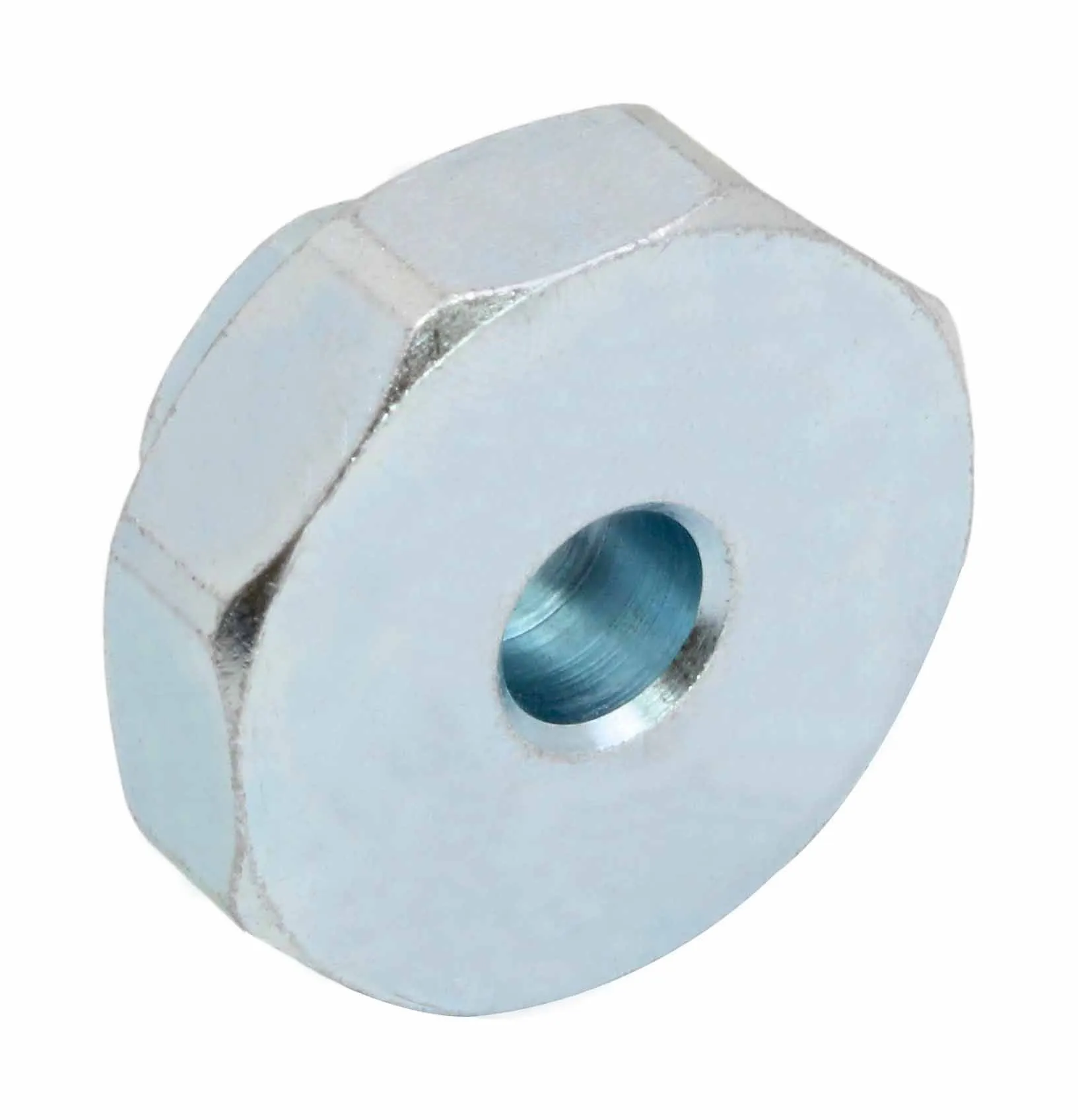 Underside of hex flange adapter showing central bored hole and chamfered six-sided profile