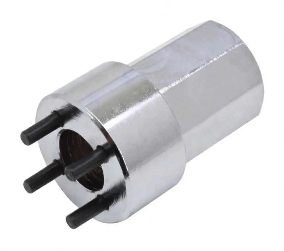 Perspective view of chrome hex socket with internal threaded cavity, four black pins at the front and stamped marking on the body