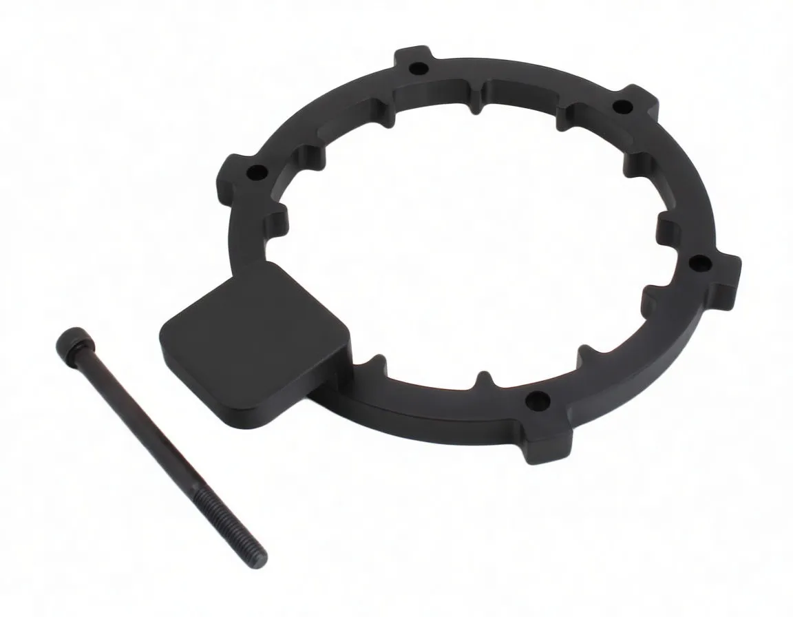 Top oblique view of notched plastic alignment ring with mounting pad and separate threaded bolt